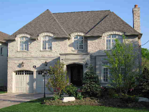 A large house with a driveway and garage.